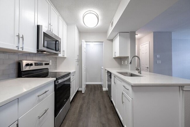Building Photo - Spacious 2-Bedroom Elite Apartment with Private Balconies & Washer/Dryer