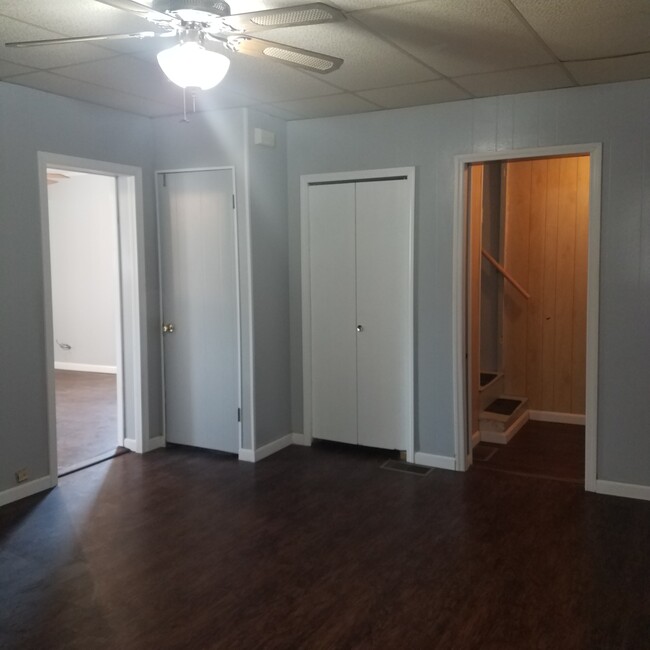 Dining room looking at kitchen, closet, and linen closet/entry to upstairs - 1201 E Walnut St