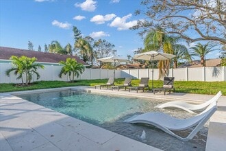 Building Photo - 5BR New Pool 10 min from Beach Fully Furnished