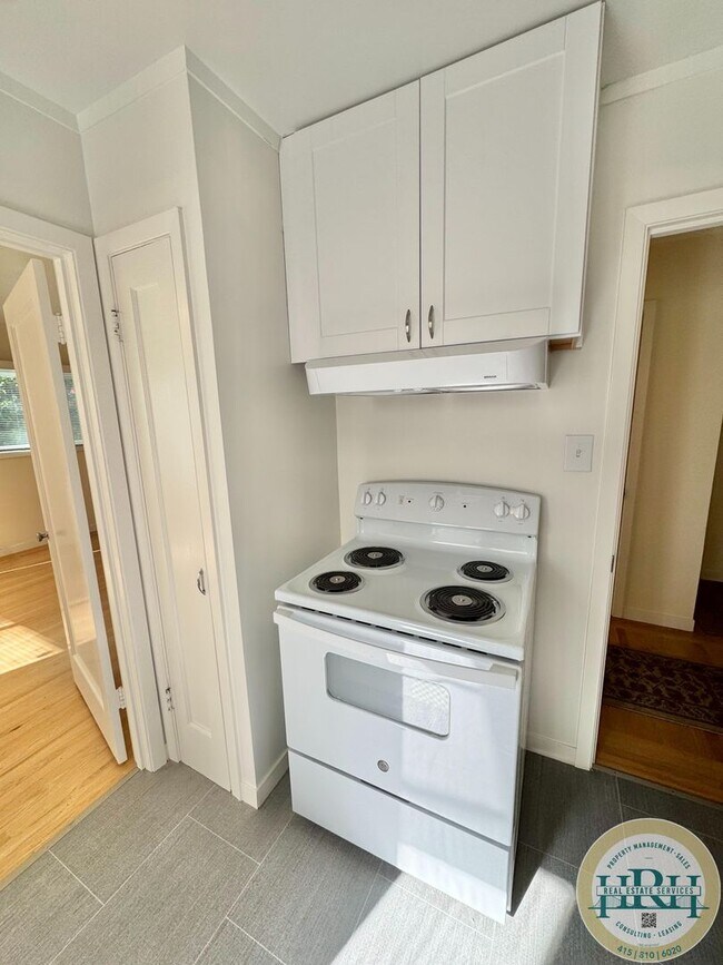 Building Photo - Spacious & Bright 2BR|1BA w/ One Garage Parking Spot Included