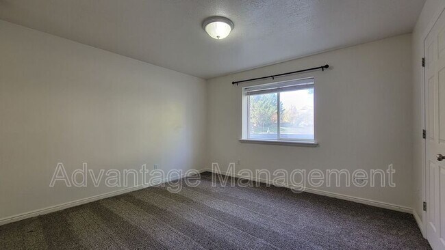 Building Photo - 8083 N Ridge Loop E