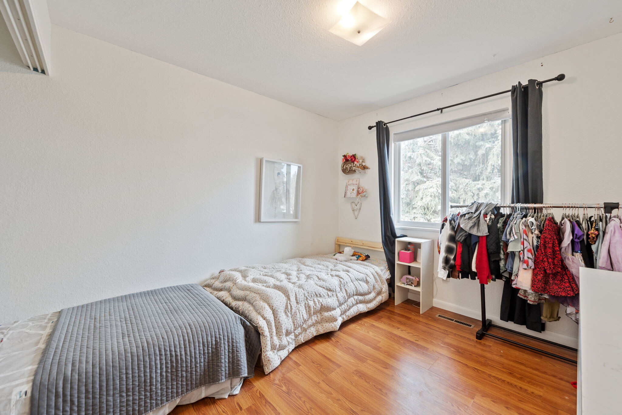 Versatile third bedroom with closet and natural light. - 3418 Stratton Dr