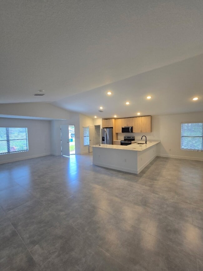 Building Photo - Brand-New 4-Bed Beauty with Attached Garage in Palm Bay – Modern Comfort, Prime Convenience!