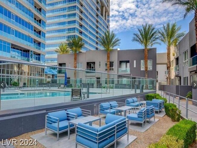 Building Photo - Iconic Strip-View Luxury | Elegant 1BR + Den High-Rise Residence