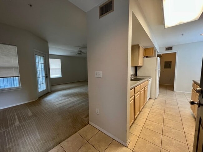 Building Photo - Move in NOW- Spacious 2 bedroom 1 bath condo on 3rd floor in gated community! Water included with...