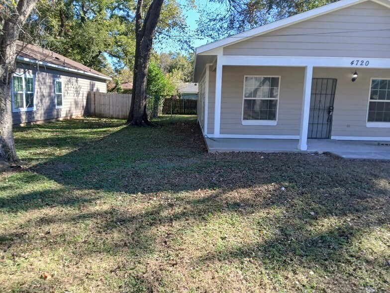 Beautiful beige home with white trim and large front yard. - 4720 Burma Rd