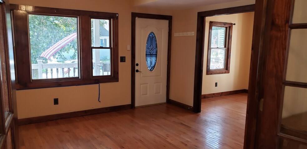 Livingroom to Front door, bedroom on right - 87 Woodlawn St