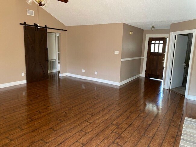 Building Photo - Lovely well cared for home on an extensive landscaped corner lot! Spacious family room with high ...