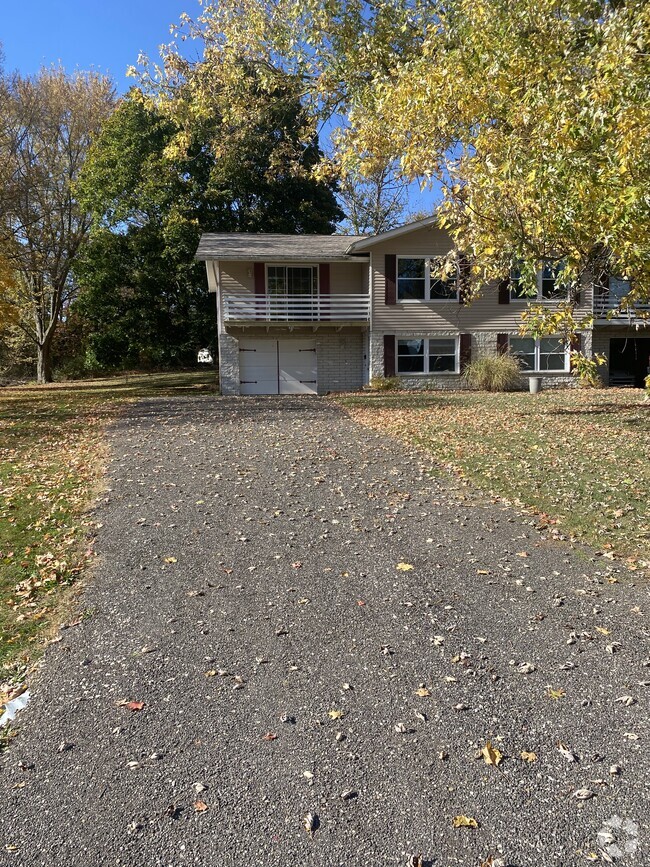 Front of house with garage and balcony - 4472 King Arthur Dr