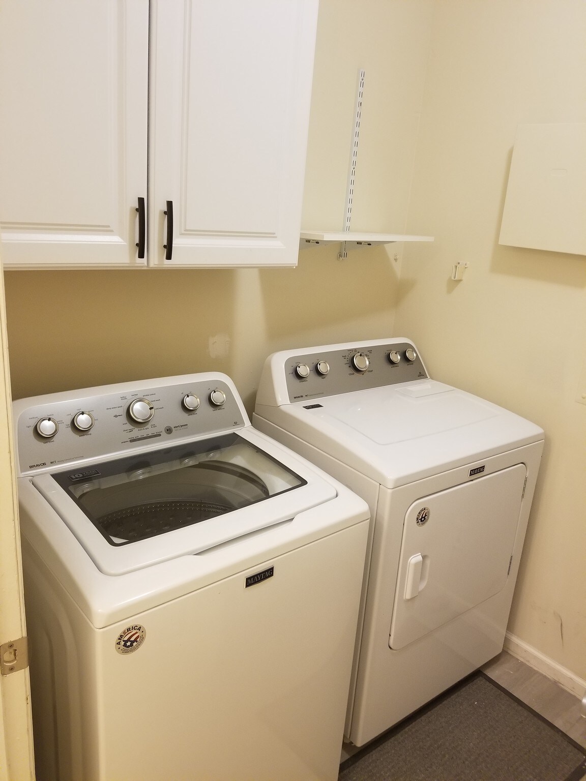 Laundry room with cabinets and washer and dryer - 6126 Inishmore Ln