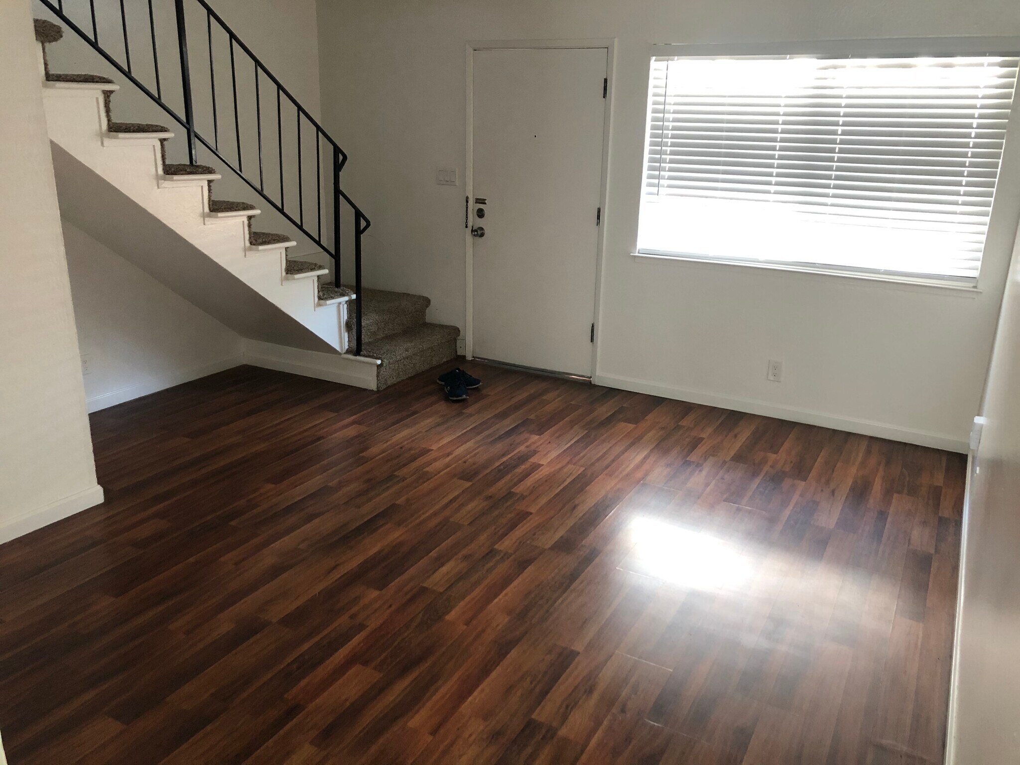 Looking from eating area . Living room, front door, stairs to 2nd story - 63 S 9th St