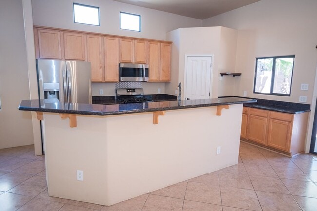 Building Photo - Gorgeous 3 Bedroom 2 Bathroom Home with Tile Throughout! Central A/C, 2 Car Garage!