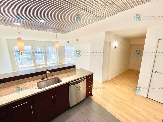 Building Photo - Modern 1 Bedroom 1 Bath Luxury Condo at Th...