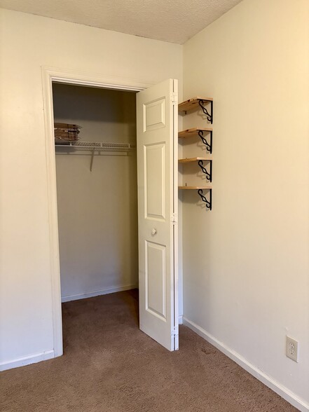 Upstairs closet and built-in shelves - 208 Quarter Trl