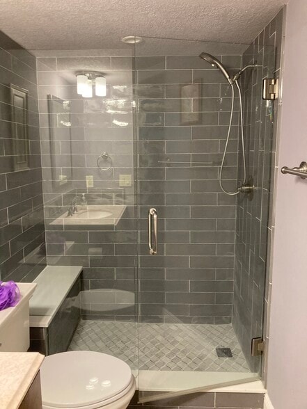 two beautifully showers with glass enclosure - 8150 Brent St