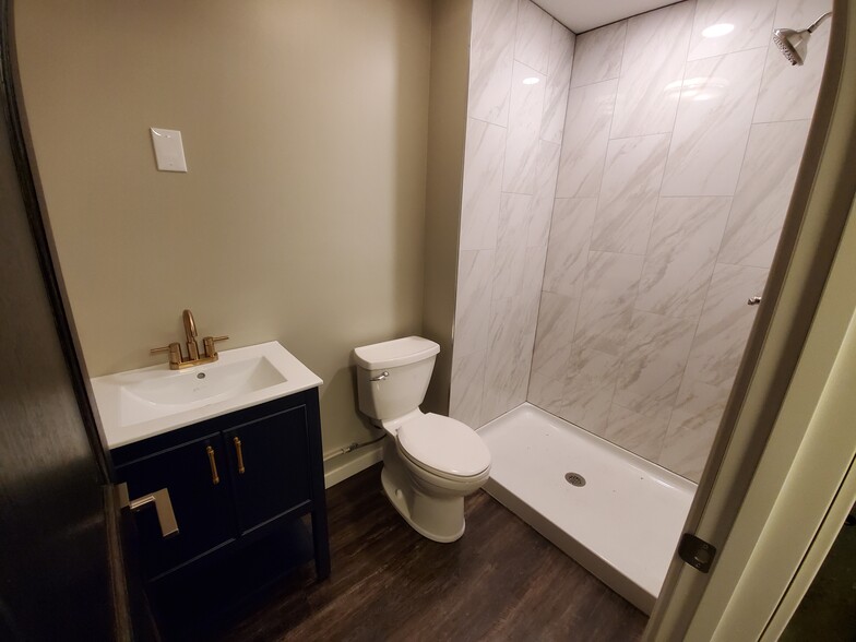 This is the brand new lower level bath. Tiled shower surround and new vanity. Mirror is on order. - 2525 Cedar Hills Drive