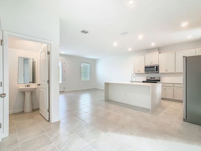 Building Photo - New Luxury Townhome in Celebration with All porcelain tiled floors. Island Village new construction