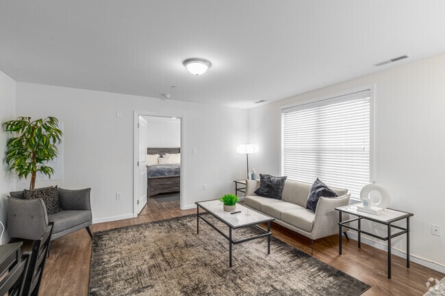 3BR, 2BA - 1200SF - Living Room - ER UC Flats LLC