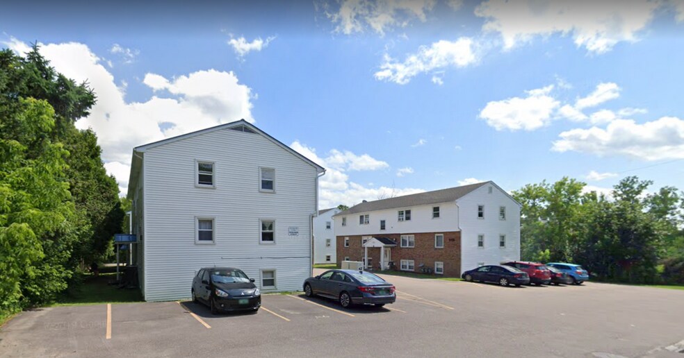 119 Main Street 4A outside, with covered front entrance. Tenants are guaranteed one parking spot next to unit, and spot(s) in the rear of association lot. - 119 Main St