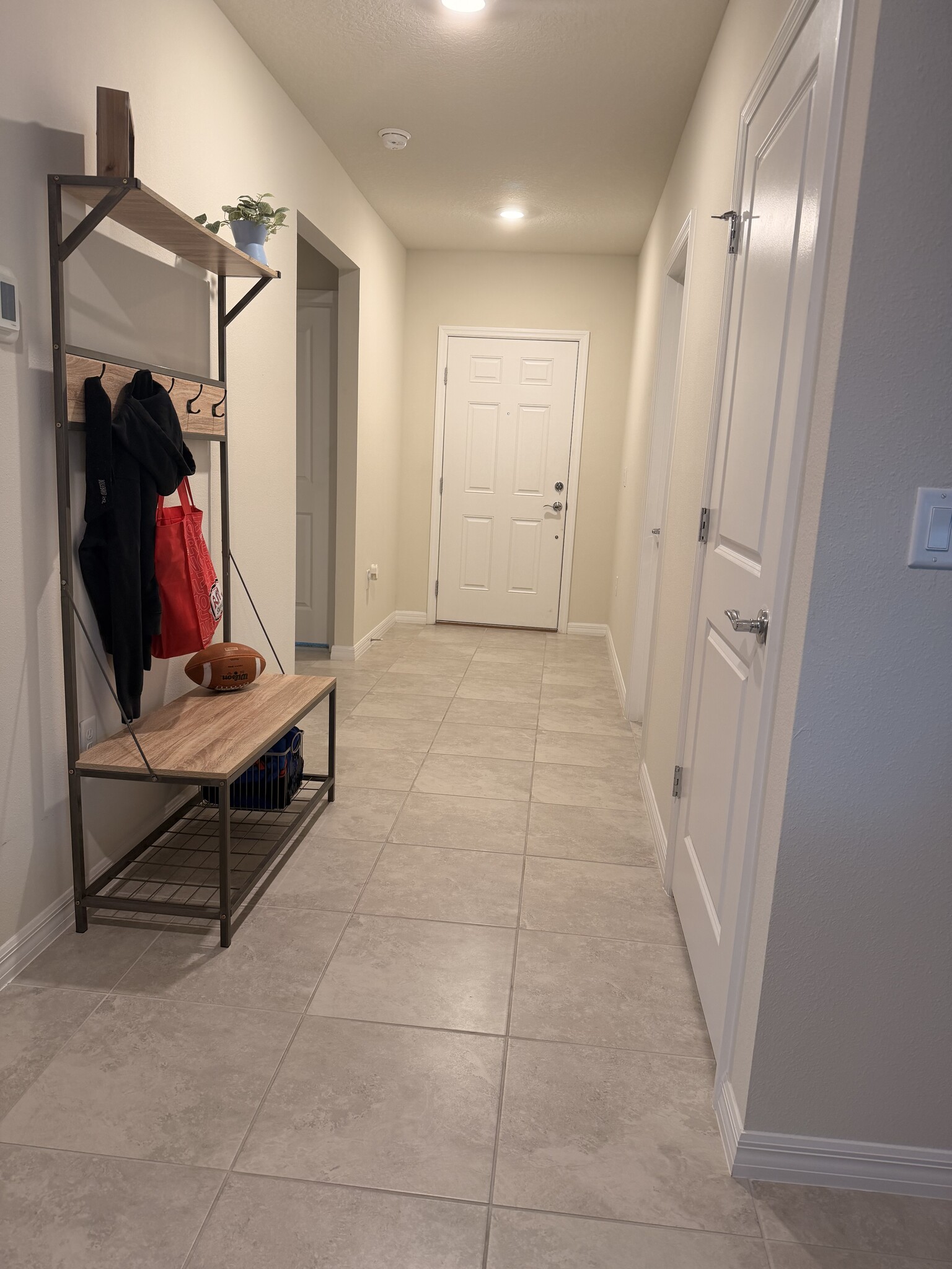 Front entry includes utility/storage closet - 3438 Orange Rose Loop