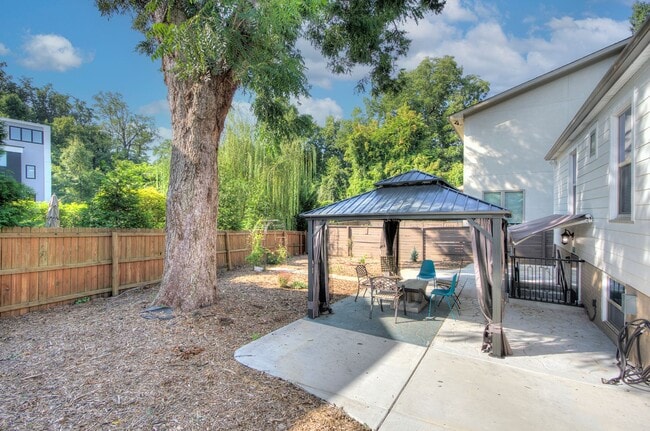 Building Photo - Discover the charm of this FULLY FURNISHED basement unit, tucked away in a beautifully updated bu...