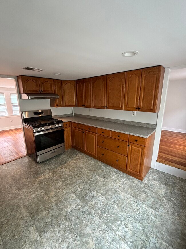 Kitchen- smaller bedroom on right- living room/entrance on left - 15 Eastern Ave