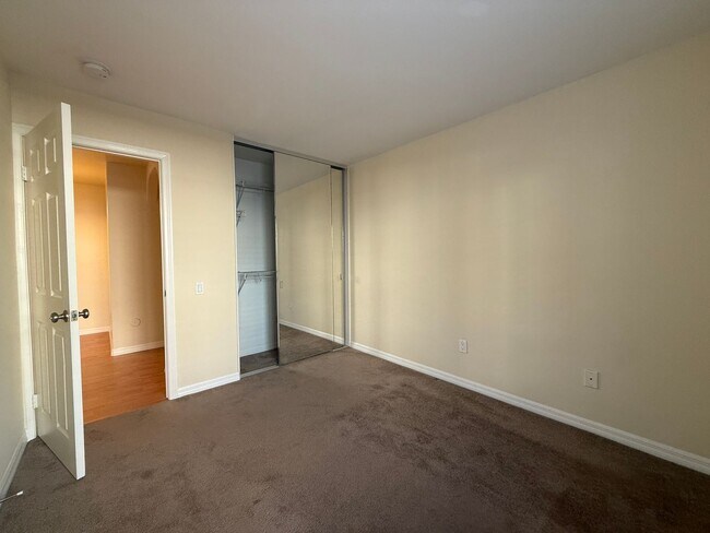 Building Photo - Upgraded Condo with Private Patio, AC, Pool, Gym, and Covered Parking in Gated Community