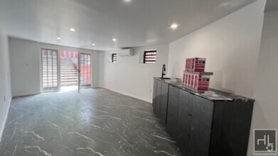 Building Photo - 100% GUT RENOVATED DUPLEX  with PRIVATE GA...