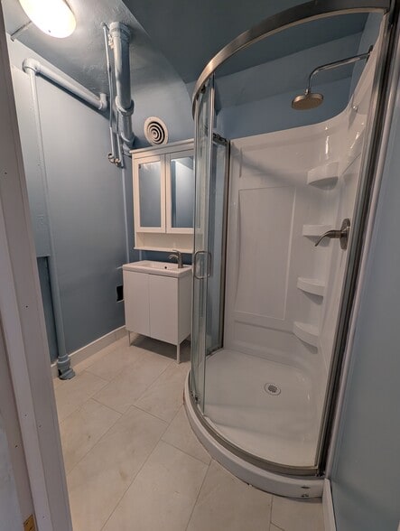 Fully renovated bathroom, brand new shower, vanity/sink, and medicine cabinet - 1280 Race St