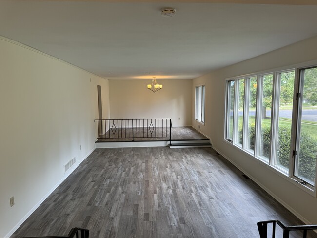 Living room with step up dining rm. - 160 Rockleigh Dr