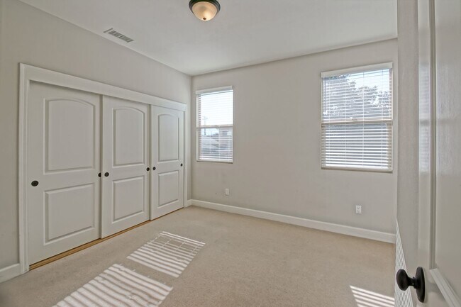 Building Photo - BUILT IN 2019: SPACIOUS & BRIGHT, DETACHED TOWNHOUSE W/ 2-CAR GARAGE & FENCED YARD IN GREAT RESID...