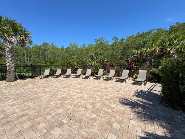 Building Photo - Beautiful End Unit Townhome Near Lake Nona w/ 2-Car Garage & Conservation Views!