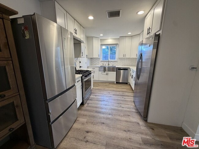 Building Photo - 8541 Dempsey Ave