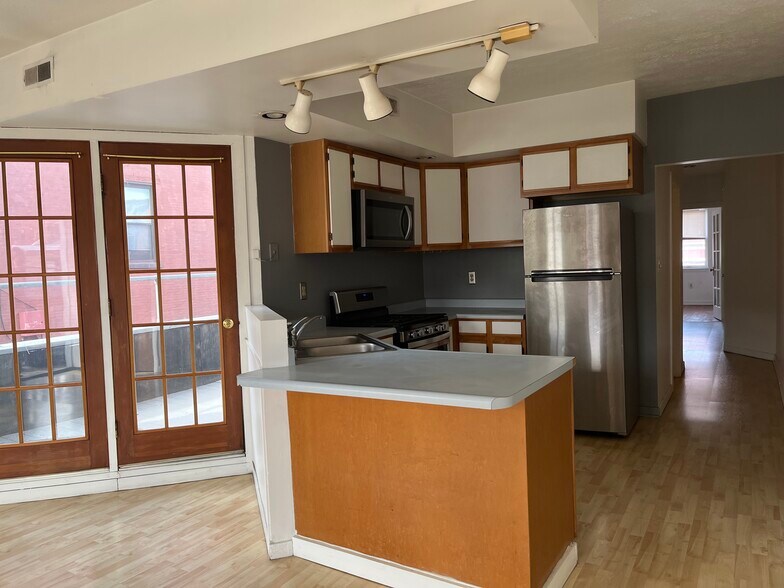 From living room to kitchen, french doors to outdoor deck, hallway to bedrooms - 2328-2 E Carson St