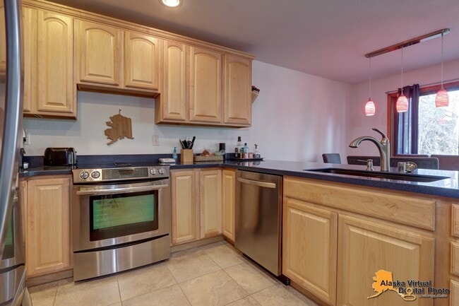 Building Photo - Cozy Eagle River Home with Backyard Trails!