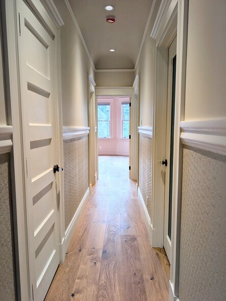 The hallway takes you to the back half of the residence. - 328 Lexington St