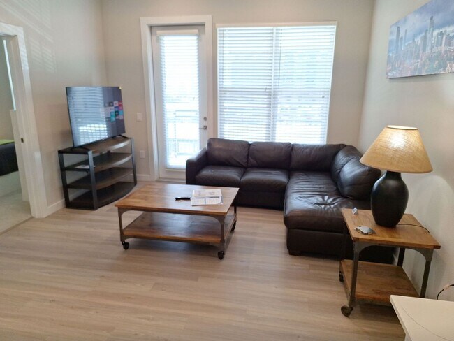 Building Photo - Your urban prairie sanctuary is here! One of a kind apartment homes where art, luxury & convenien...