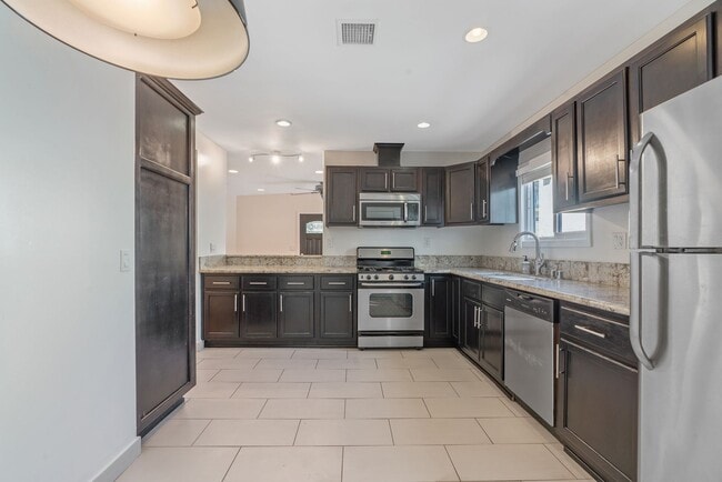 Building Photo - Stylish 2-Bedroom Retreat with Private Yar...