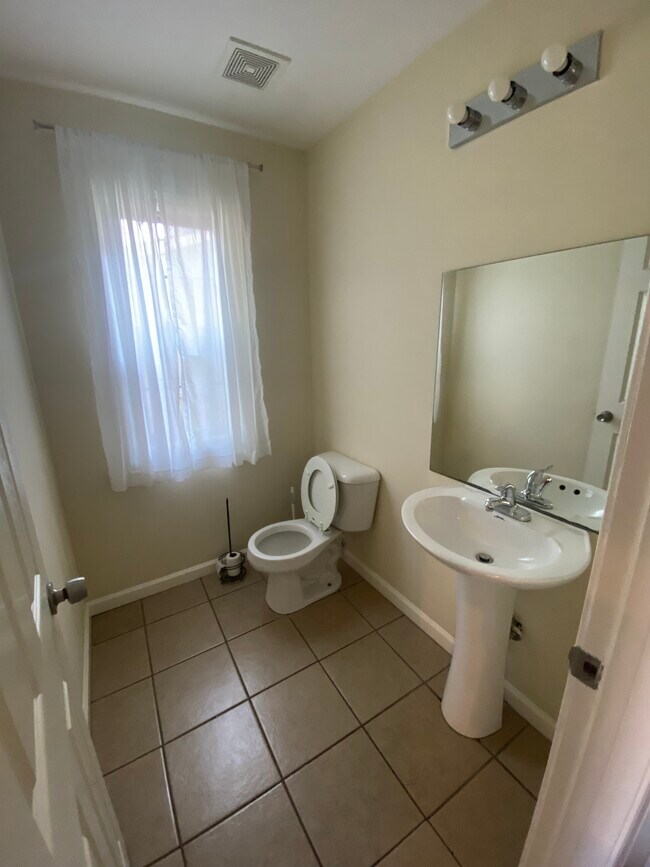 UNIT B: half bath downstairs off kitchen - 407 Kentucky Ct