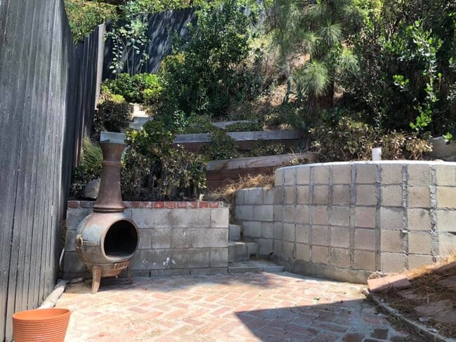 Back Patio with stairs up the hillside - 2568 N Beachwood Dr