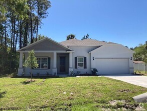 Building Photo - Like New 3 bedroom + den with French doors...