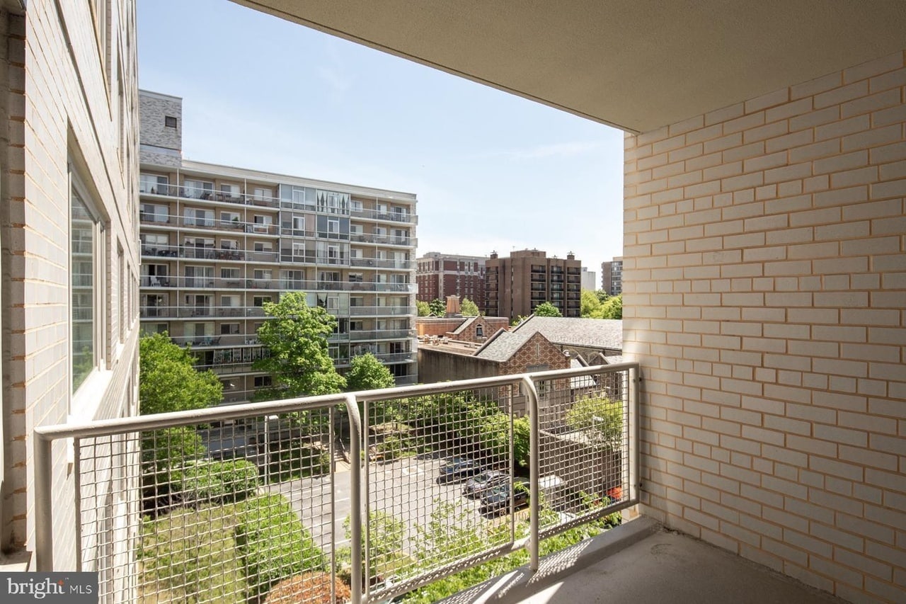 View from balcony toward street - with quiet parking lot below - 2475 Virginia Ave NW