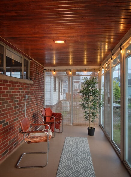 Three season room with edison lighting. - 2186 Chesterland Ave