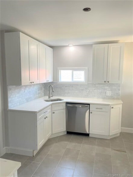 Completely upated kitchen with Quartz Counters, stone backsplach and SS Dishwasher - 10 Treadwell St