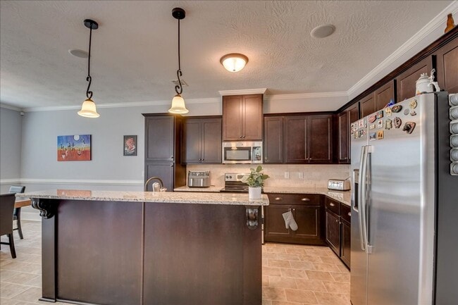 Building Photo - 4 bed, 2.5 bath home on corner lot with 2 car garage and fenced in back yard