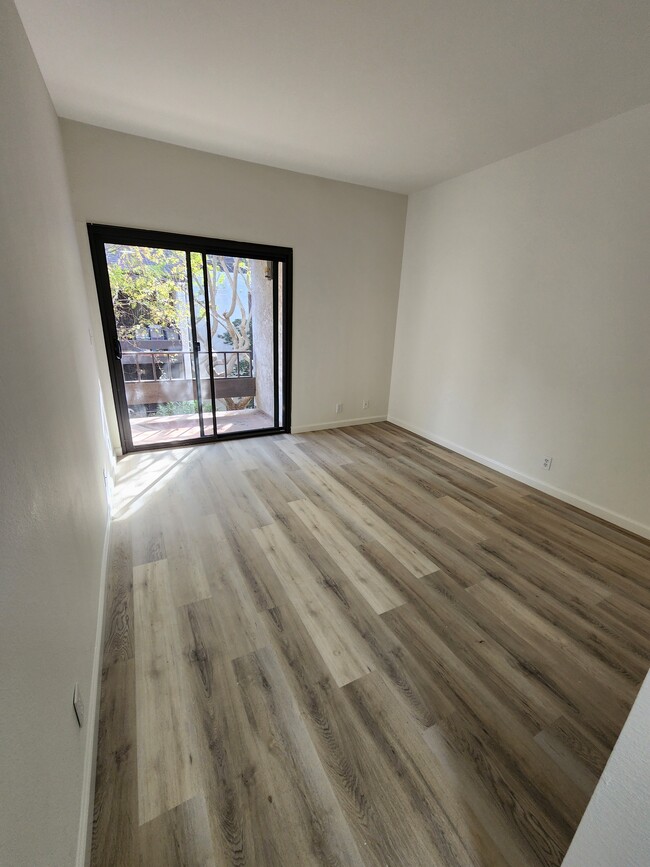 New flooring and baseboards throughout. Spacious bedroom and huge mirrored closet - 8675 Falmouth Ave