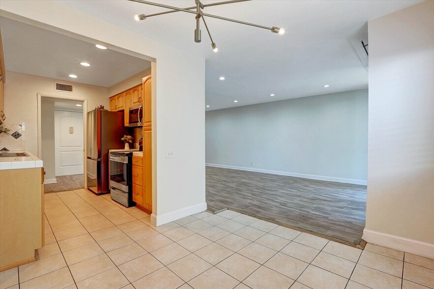 View of kitchen and living room from dining room - 4637 Willis Ave