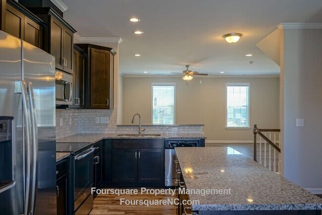 Building Photo - Modern 3-Story Townhome with Entry-Level Bonus Room, Back Deck & Garage , Community Pool in North...