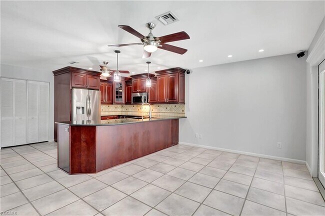 Building Photo - 42nd Terrace Southwest, Naples, FL 34116 -...