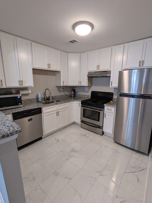 kitchen, newly modeled floors and appliances - 205 Bates St NW